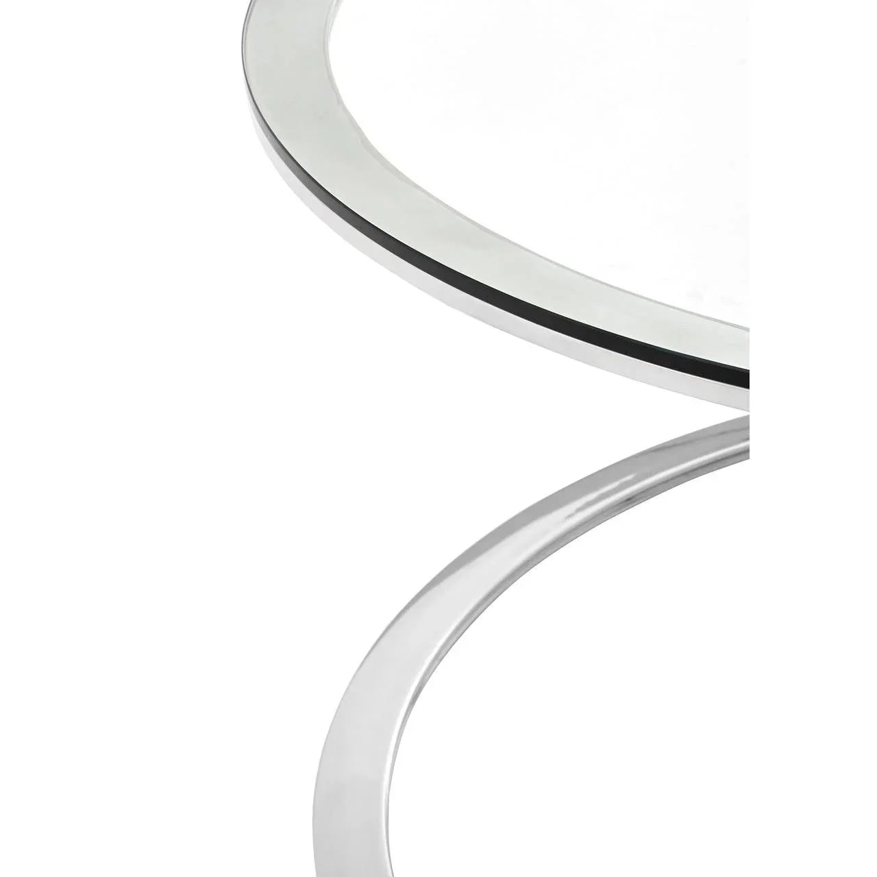 Closeup of chrome and glass coffee table edges with modern round design