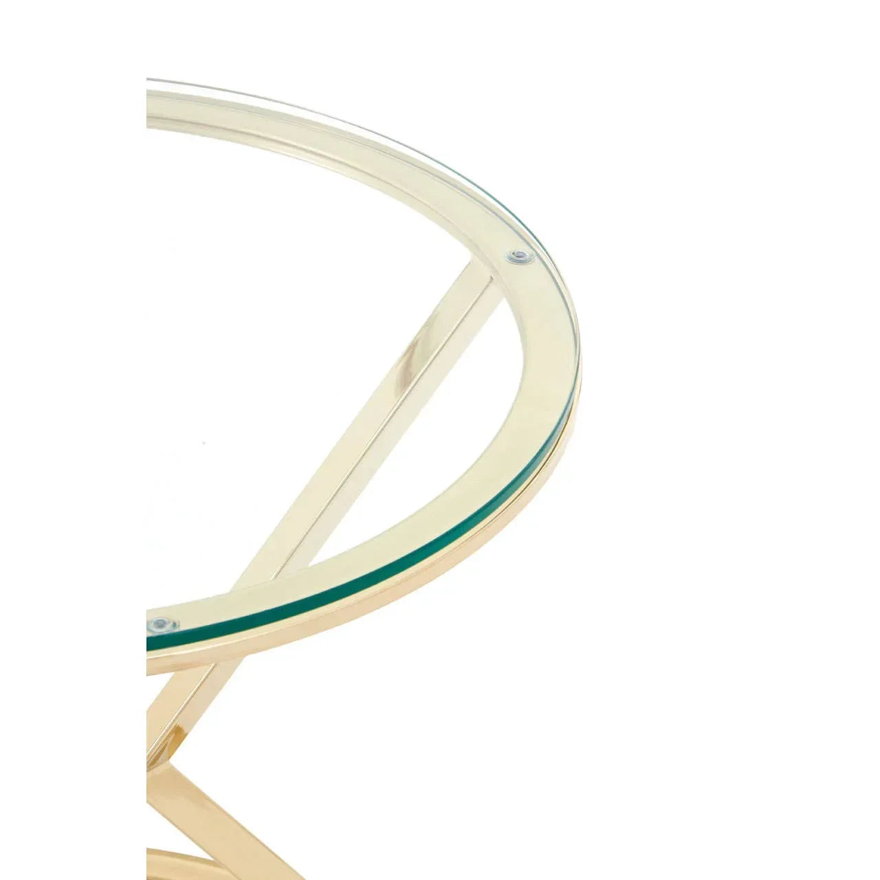 Round glass top table with gold metal frame, close-up of edge and leg detail