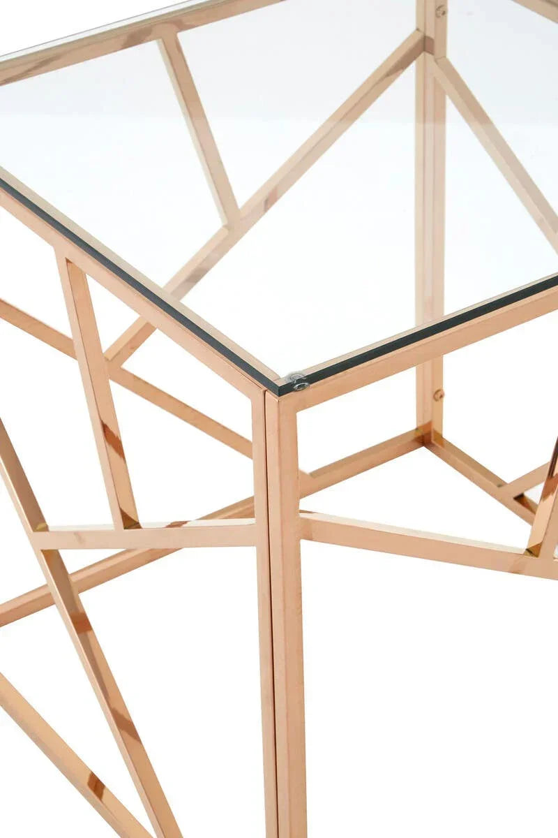 Glass topped side table with gold metal geometric frame, close corner angle