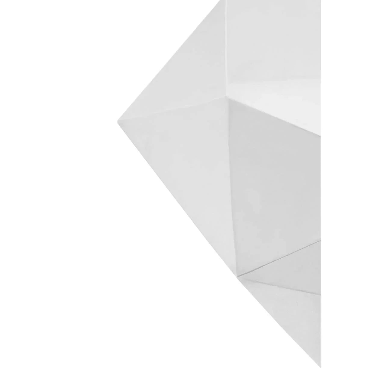 White geometric furniture detail with sharp folded angles and modern minimalist design