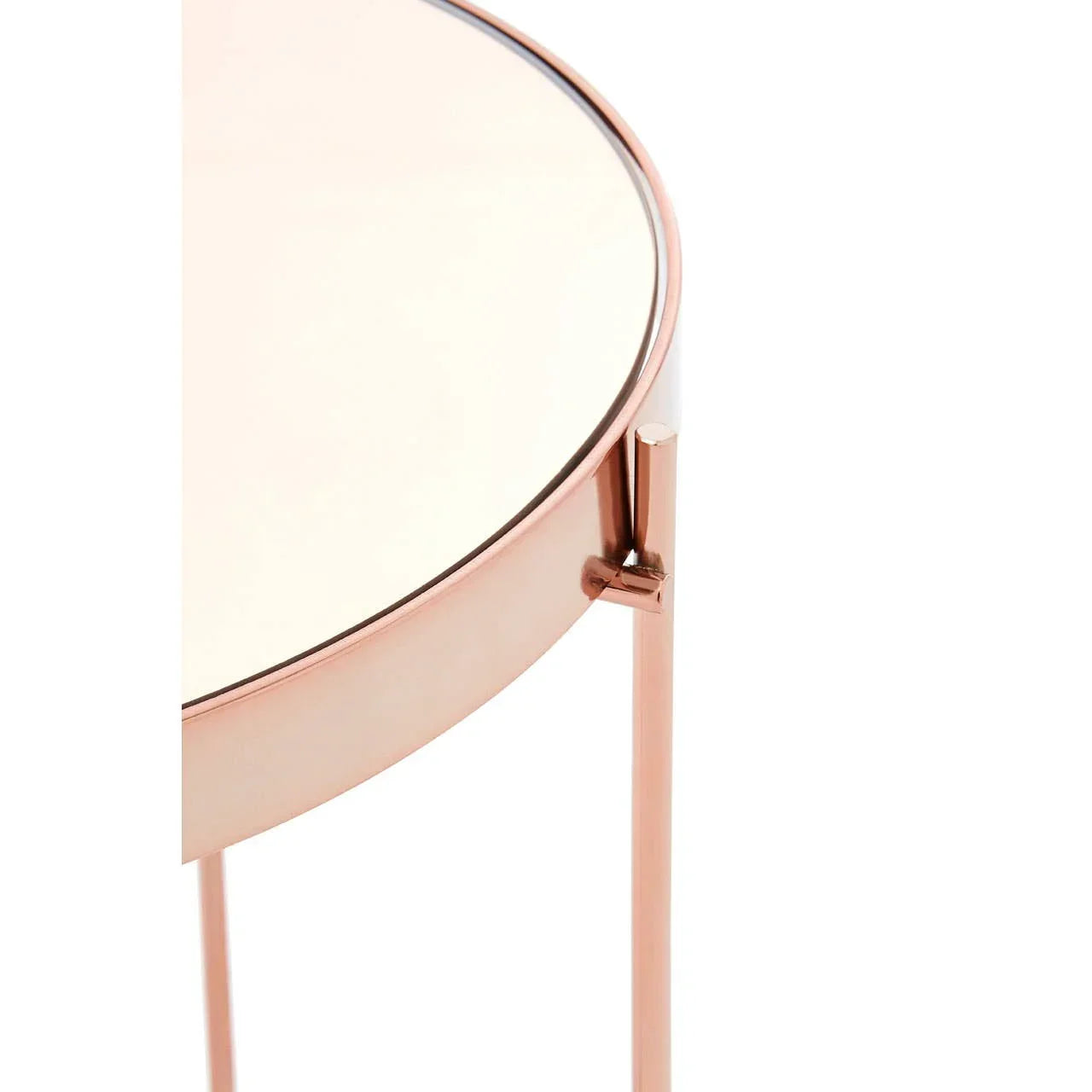 Round side table with rose gold metal frame and glass top, partial close-up view