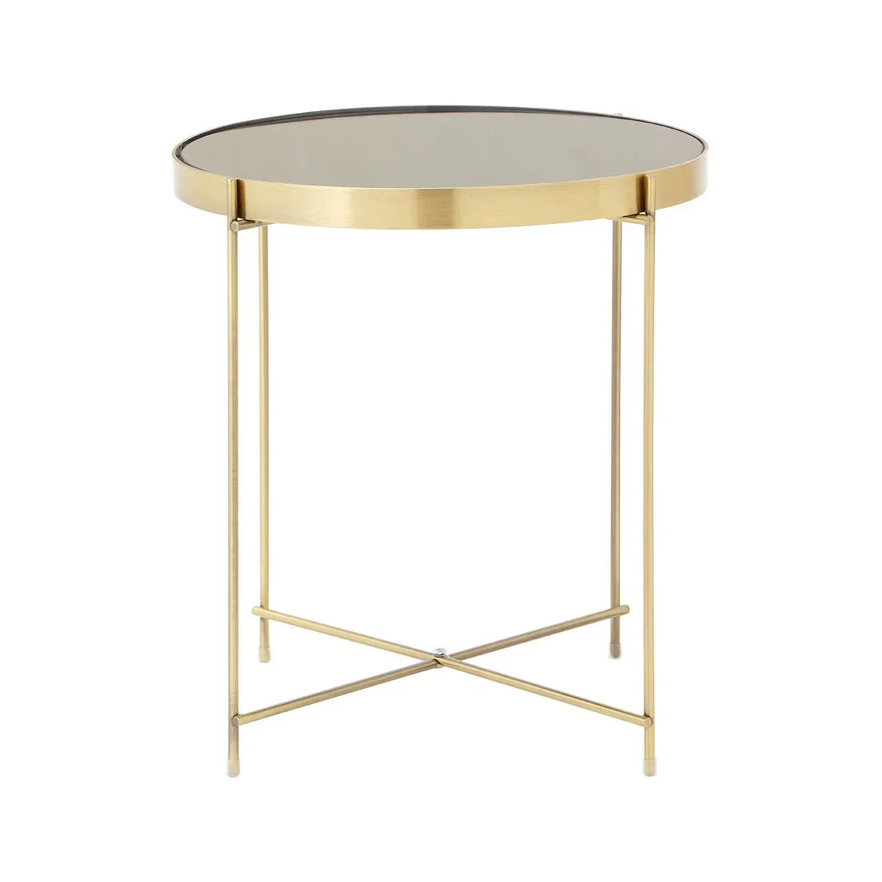 Round glass top side table with gold metal frame and crossed legs on white background