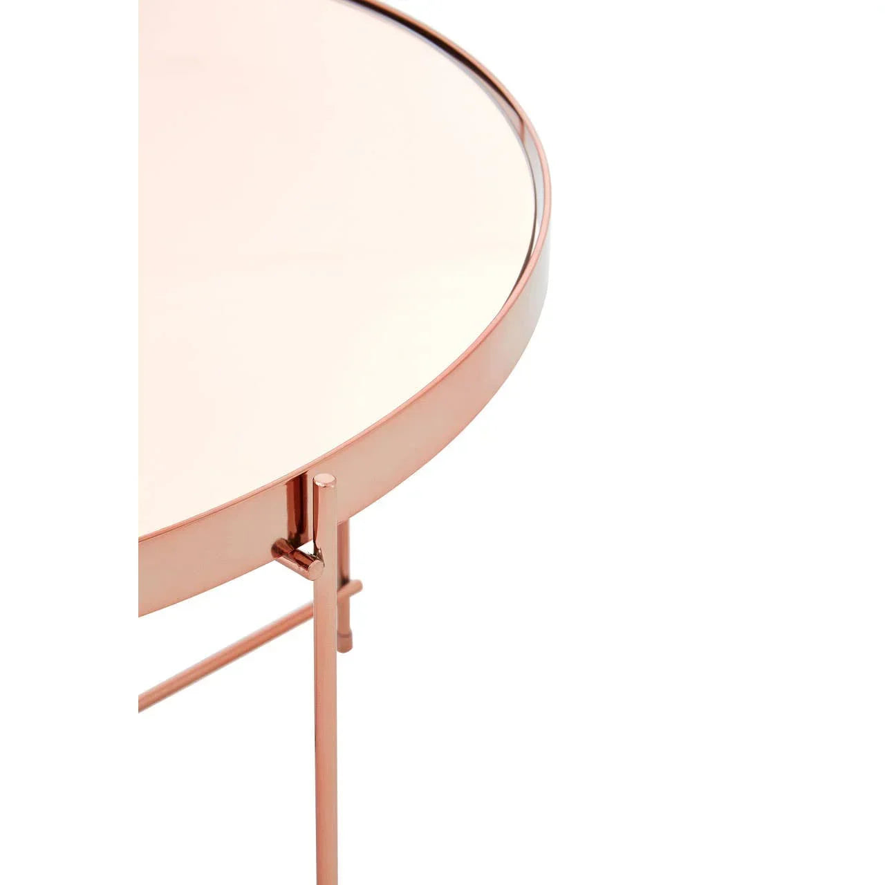 Round rose gold metal side table with mirrored top, close-up of frame and surface