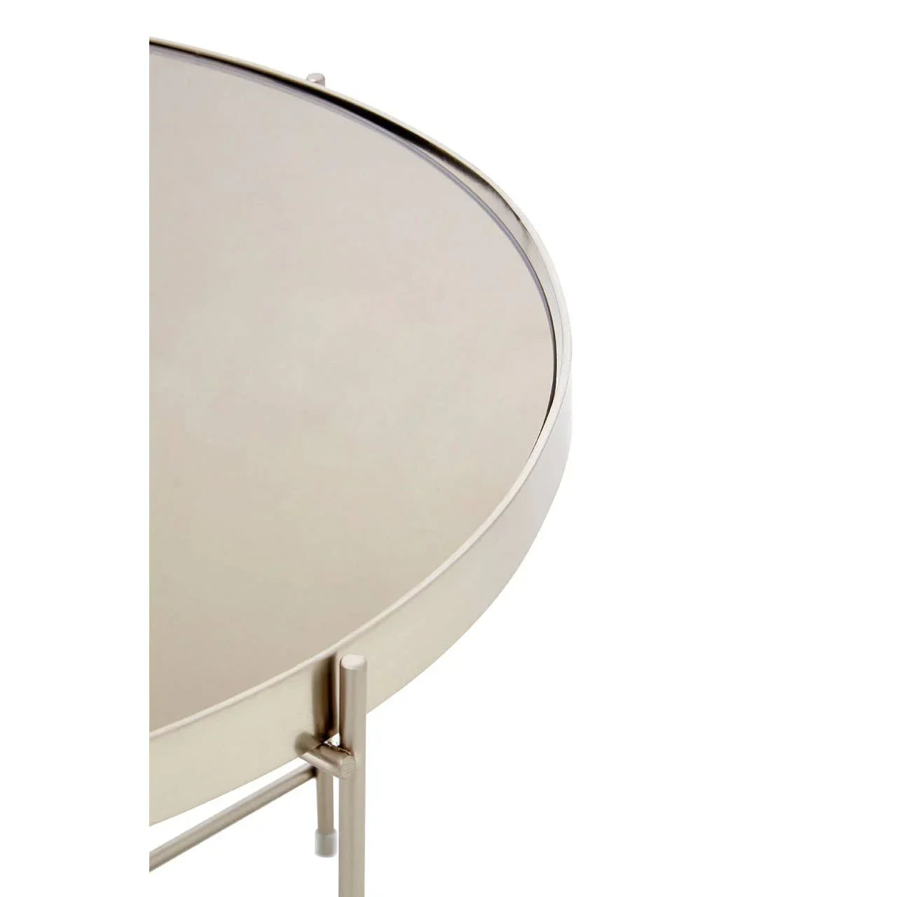 Round metal side table with raised edge and brushed silver finish, close-up of top