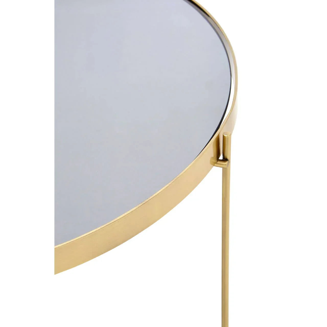 Round glass side table with gold metal frame and slim leg, close-up view