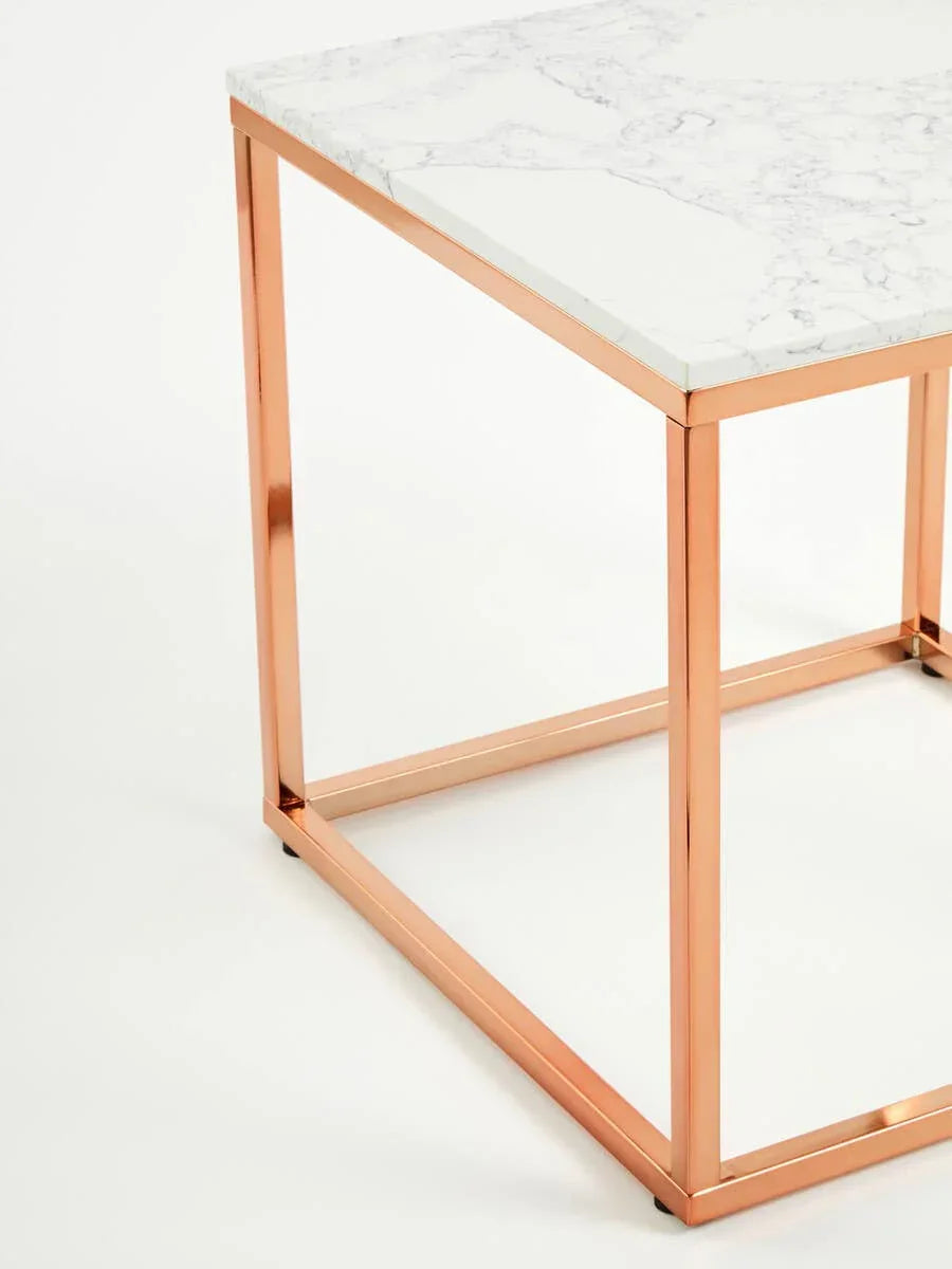 Marble top side table with rose gold metal frame, corner view