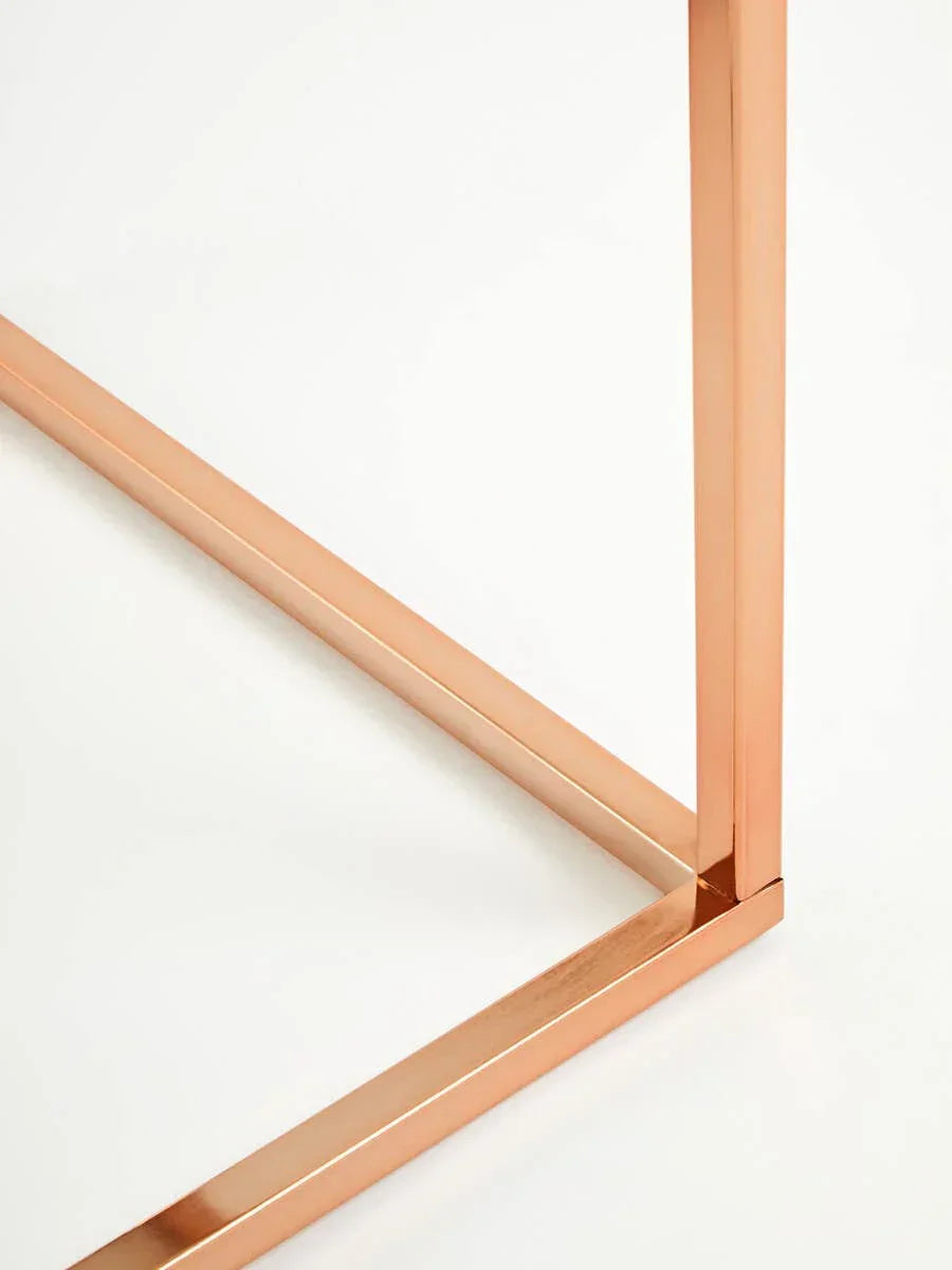 Rose gold metal table leg with clean lines on white background