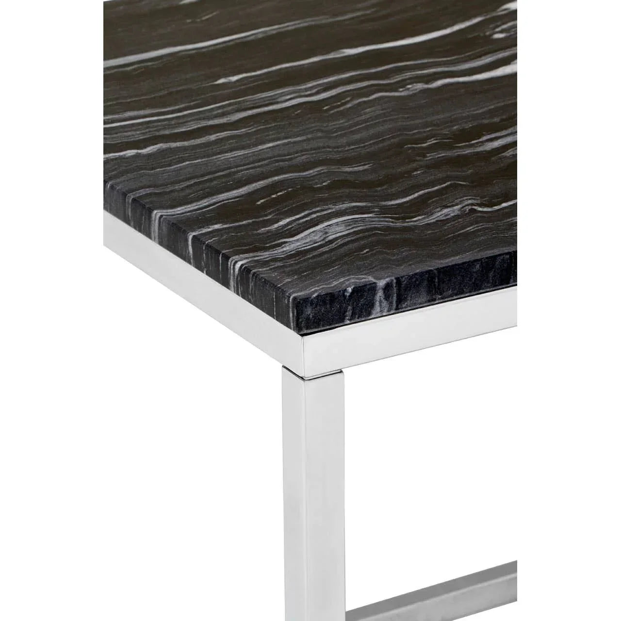Black marble dining table corner with chrome metal legs and white veining detail