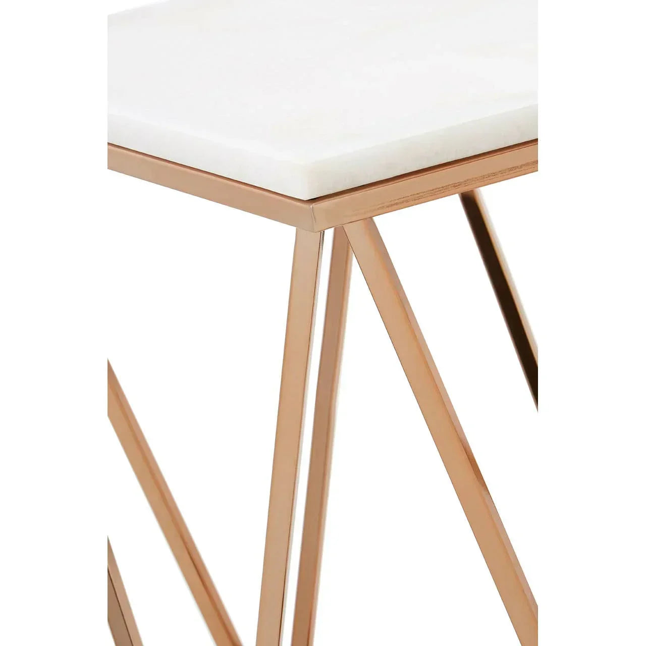 White marble top side table with gold metal frame, close-up of corner and legs