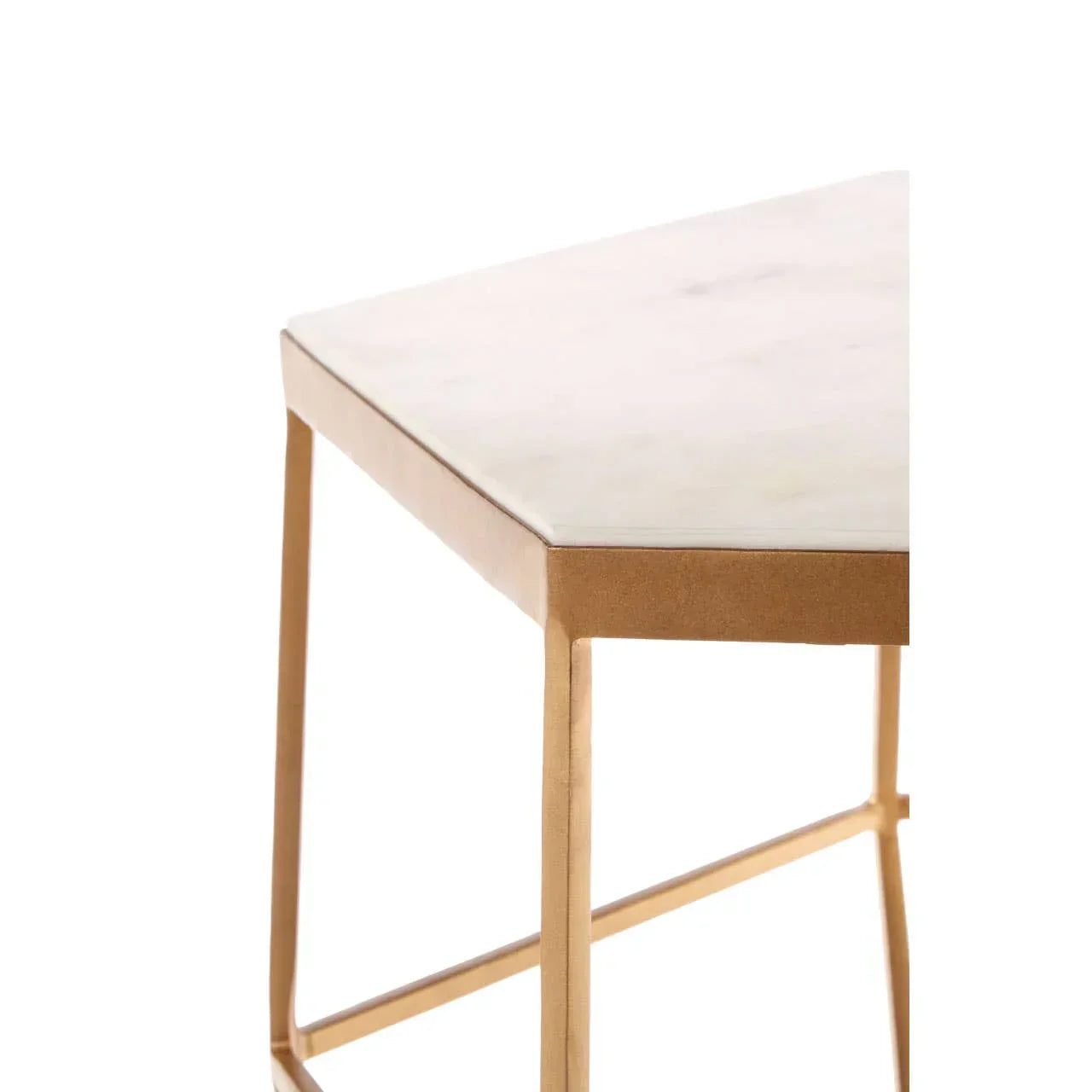 Close-up of marble top table with gold metal legs