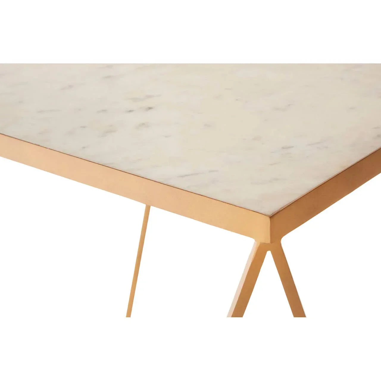 Corner view of a marble dining table with gold metal legs