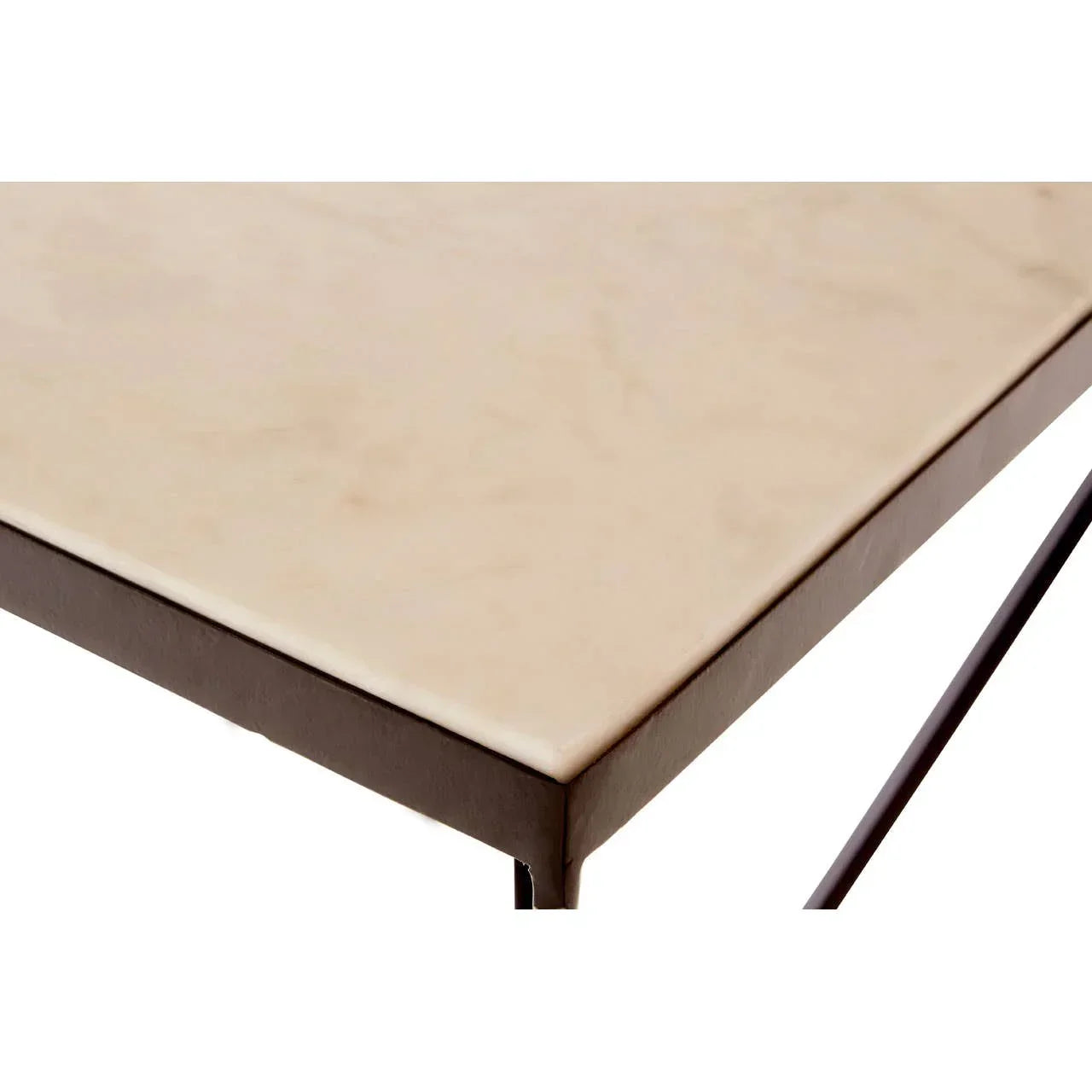 Closeup of marble coffee table corner with black metal frame