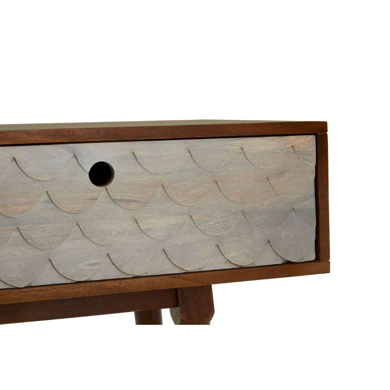 Wooden bedside table close-up showing scalloped drawer front and circular handle cutout