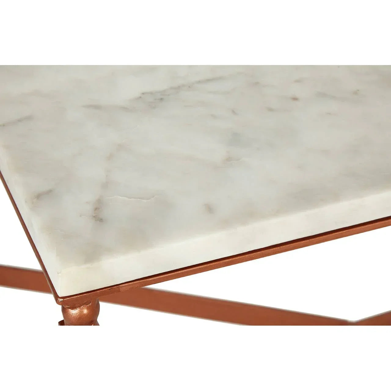 Close-up of marble table top with copper metal frame