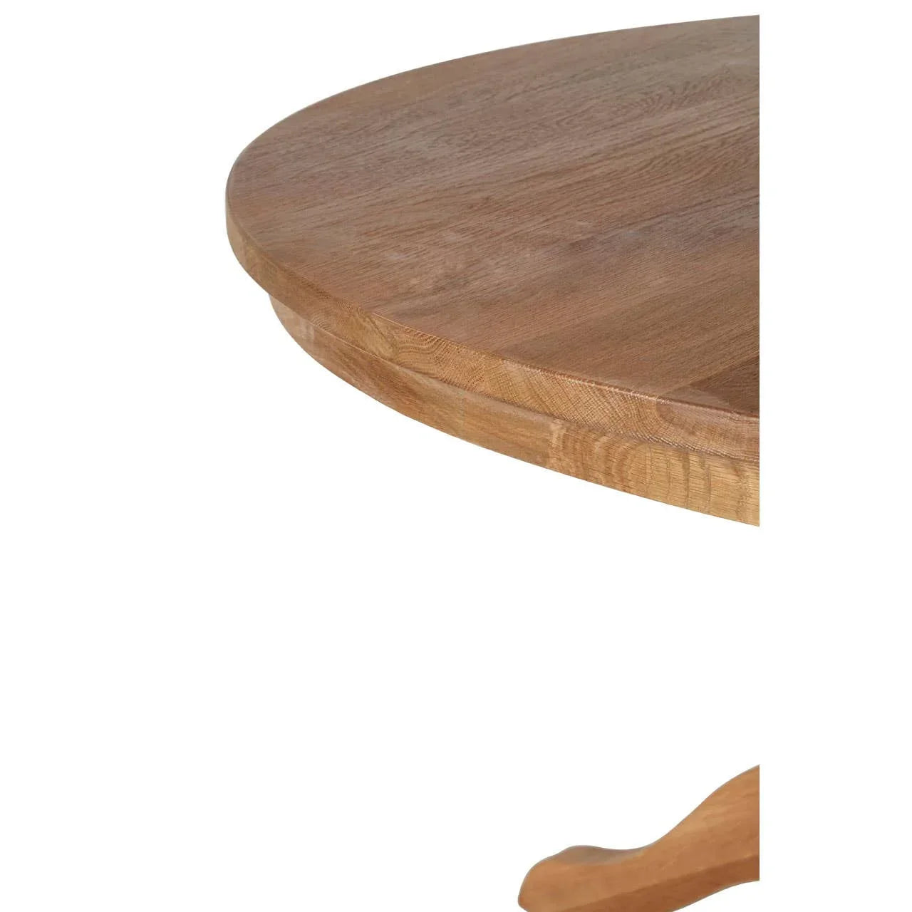 Close view of round oak dining table top with natural wood grain and edge detailing