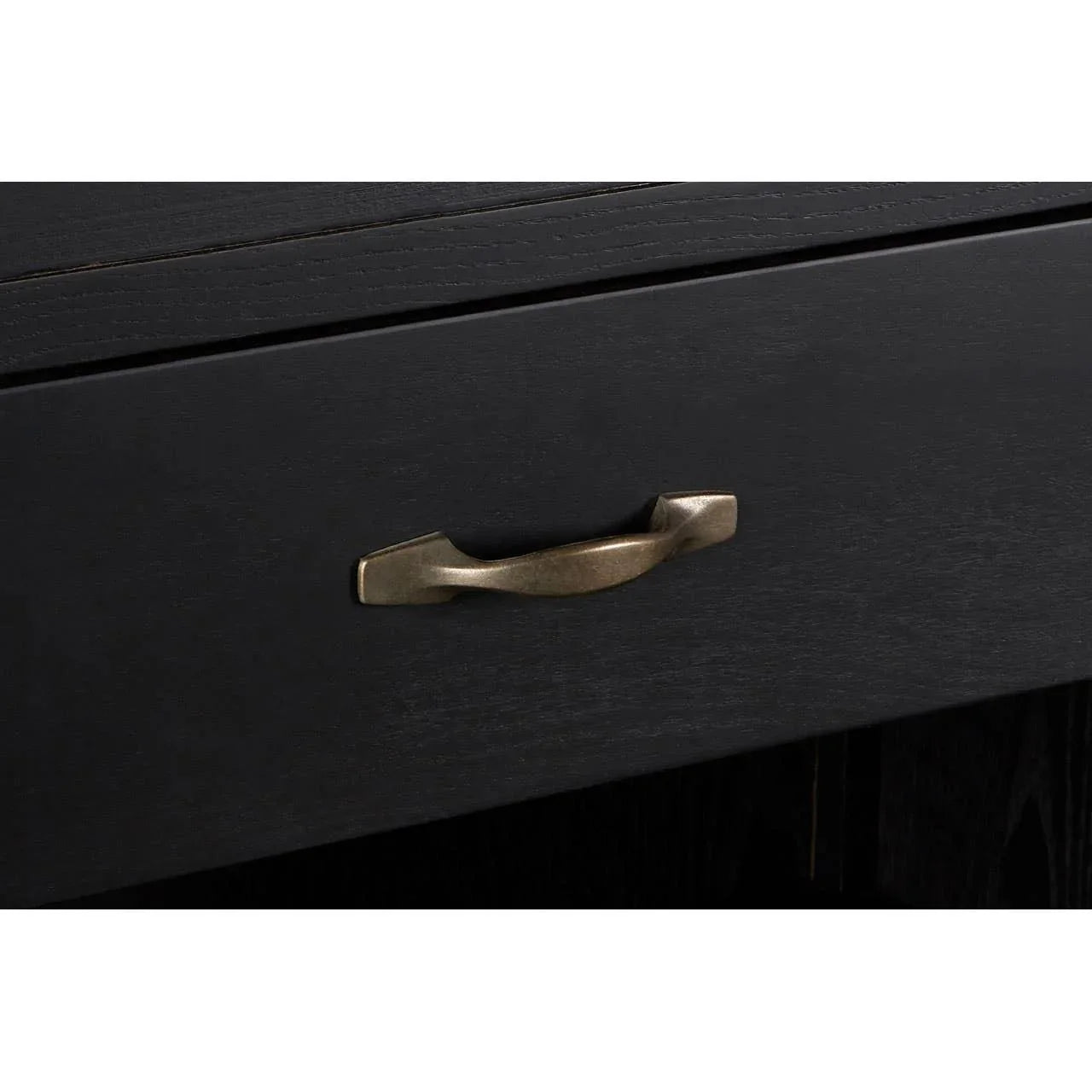 Black wooden drawer with bronze metal handle, close-up of furniture detail