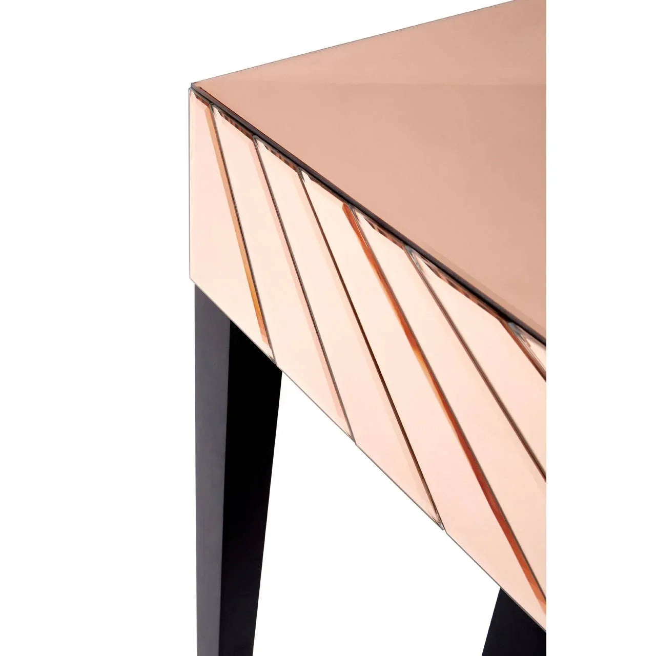 Rose gold mirrored console table with angled panel detail and black legs closeup