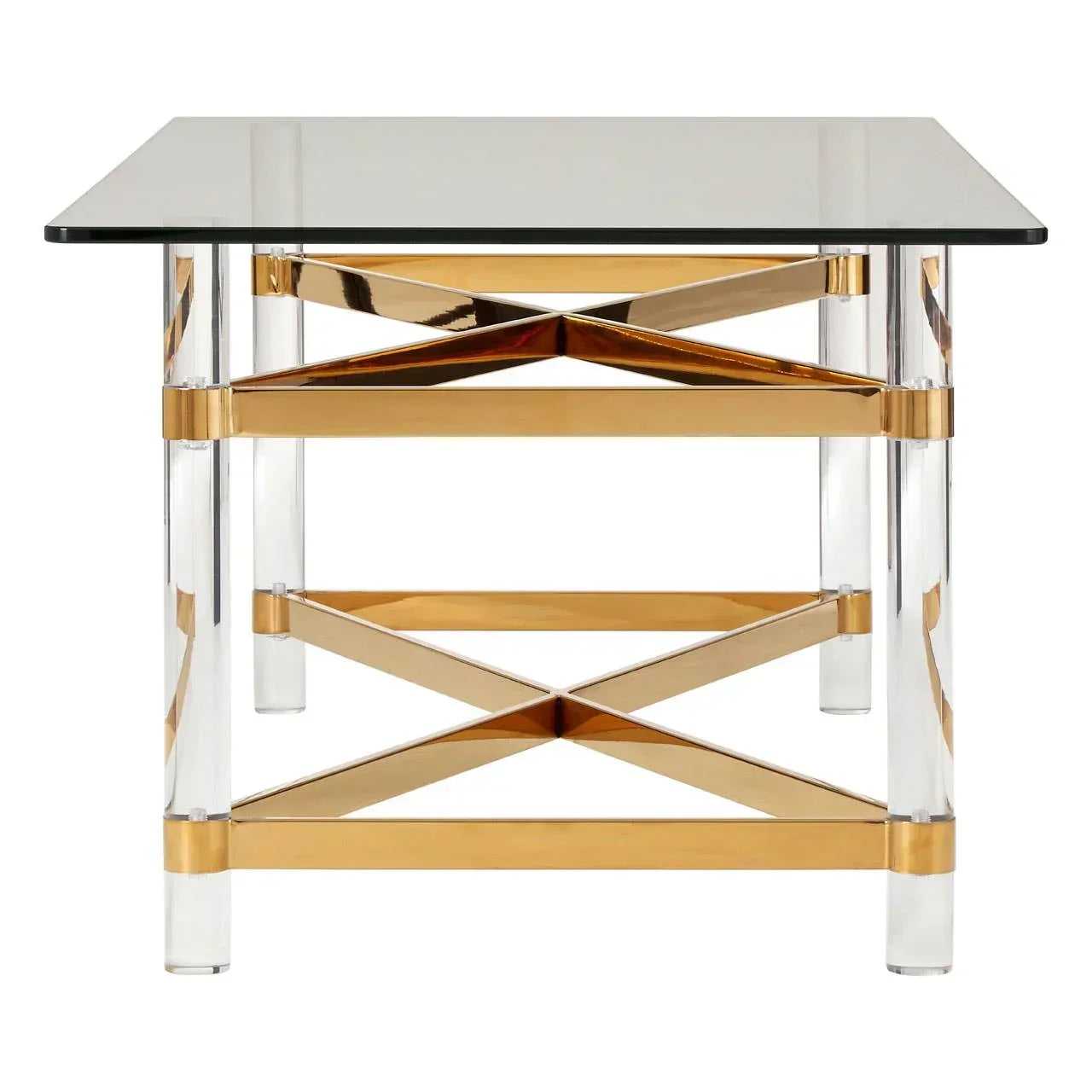Glass top dining table with gold cross frame and clear acrylic legs, front view