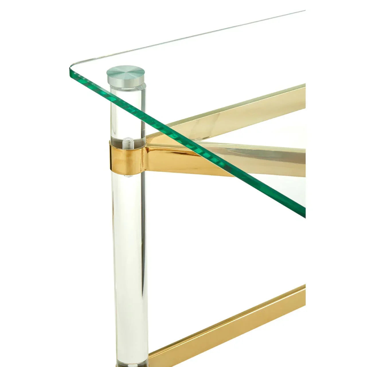 Glass coffee table with gold metal frame and clear acrylic leg, corner detail view