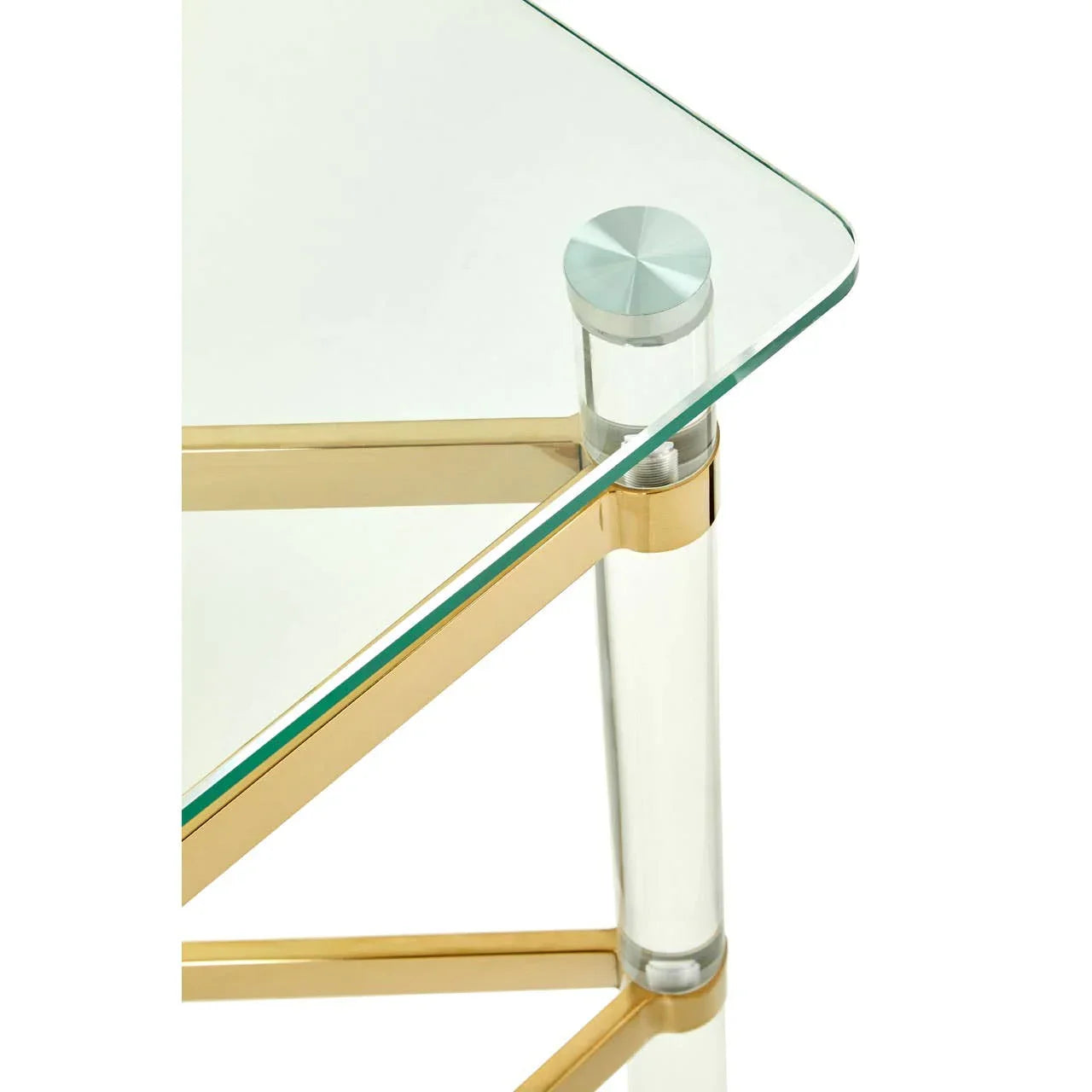 Glass coffee table with gold metal frame and clear acrylic legs, close-up corner view