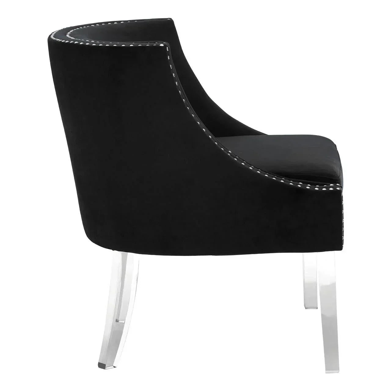 Black velvet accent chair with acrylic legs and silver stud trim, side profile view