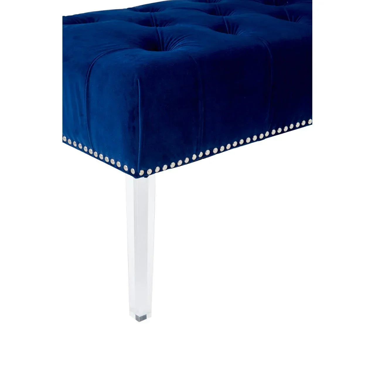 Blue velvet upholstered bench with acrylic leg and silver stud detailing