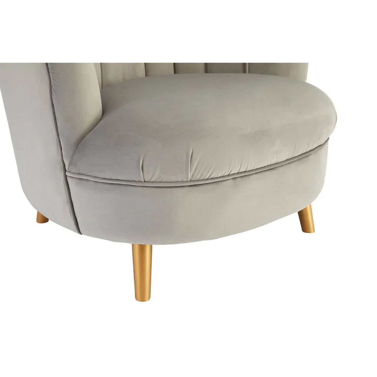 Light grey velvet accent chair with gold legs, close-up of seat and lower frame