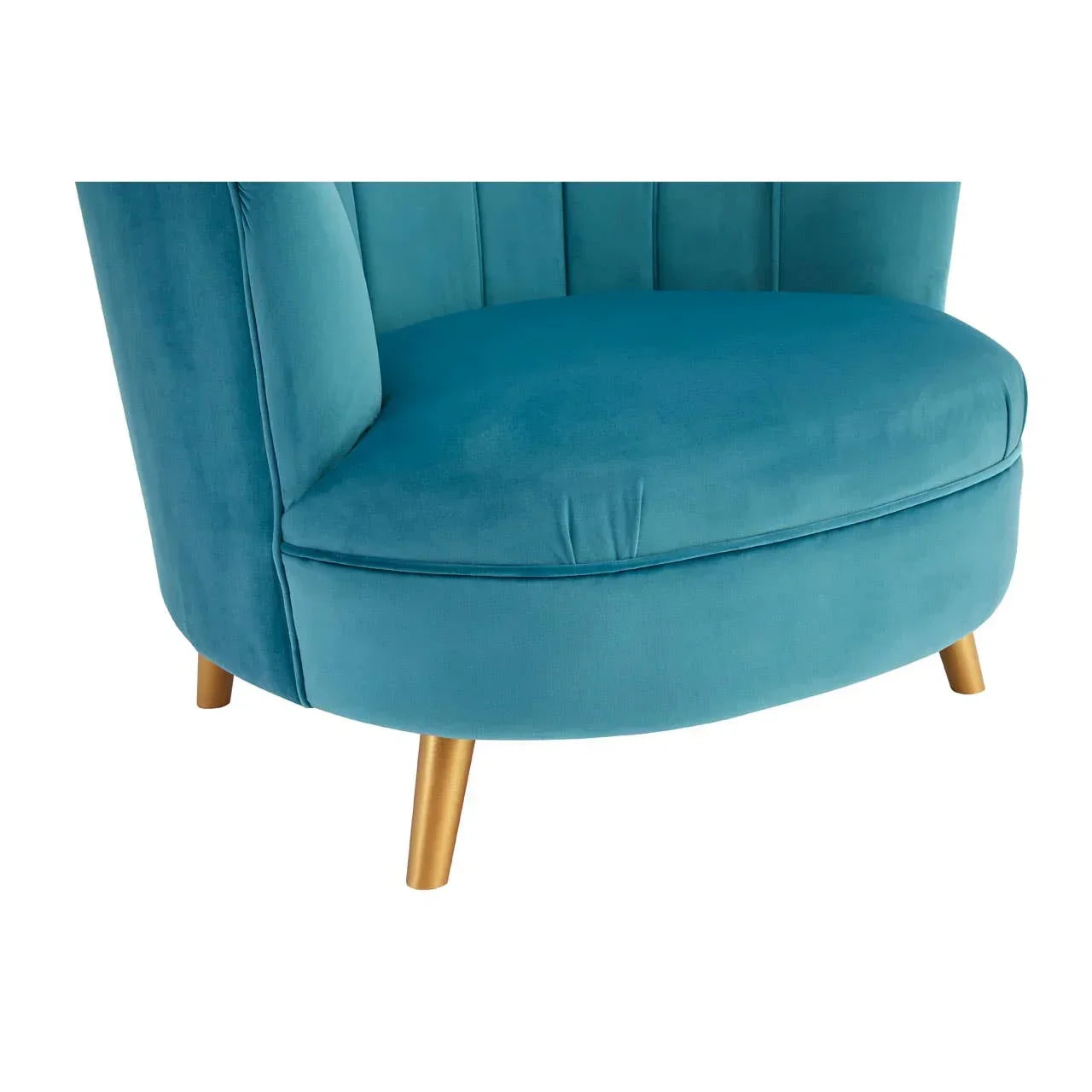 Blue velvet armchair with gold tapered legs and rounded seat, close-up view
