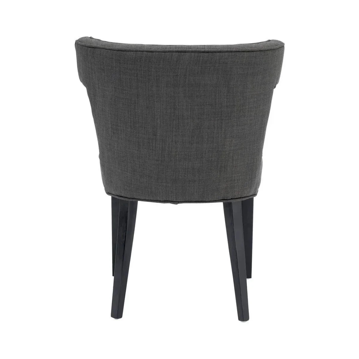 Back view of dark grey upholstered dining chair with tapered wooden legs