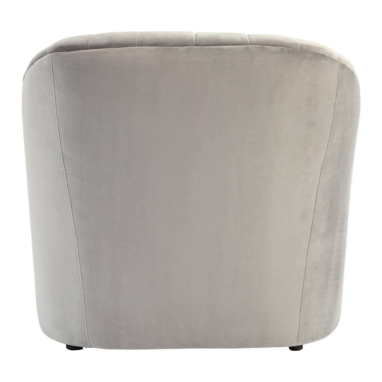 Back view of light grey velvet armchair with rounded contours and subtle seam detailing