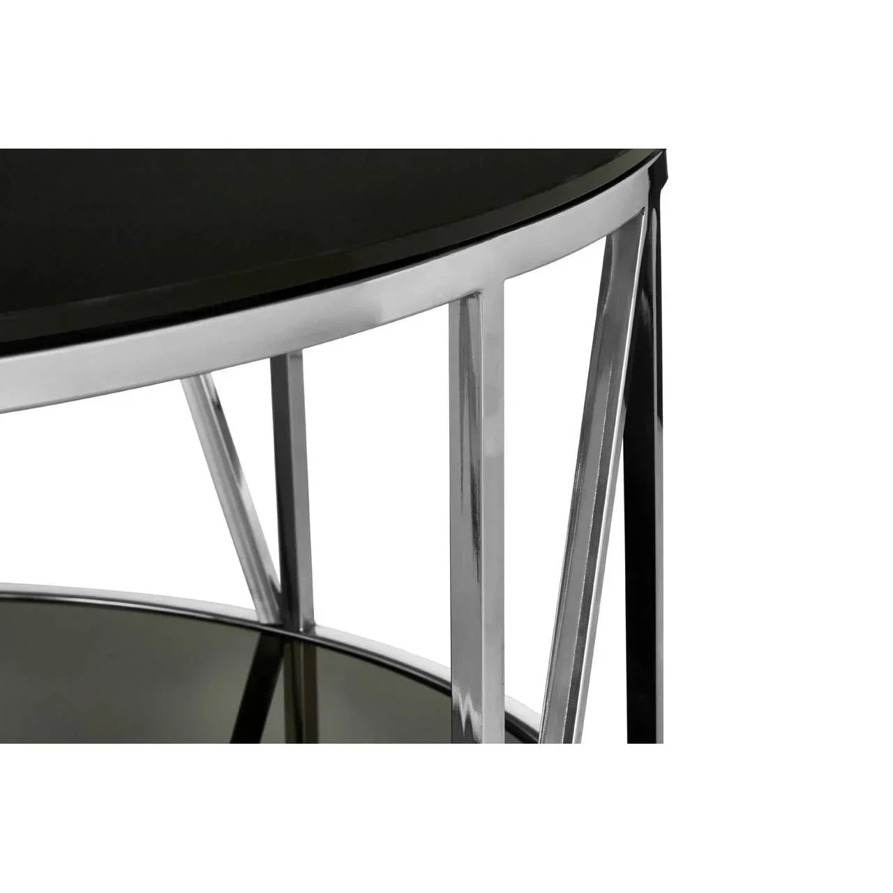 Round glass side table with chrome frame, close-up on legs and black tabletop