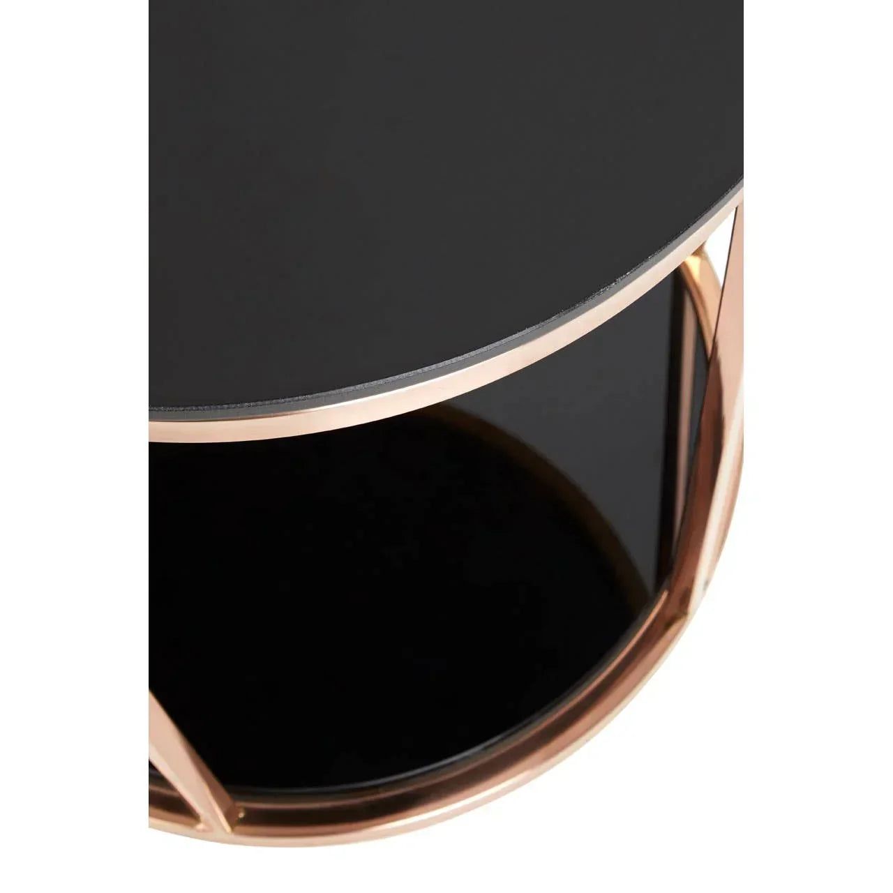 Round black glass coffee table top with gold metal frame, close view angled from above