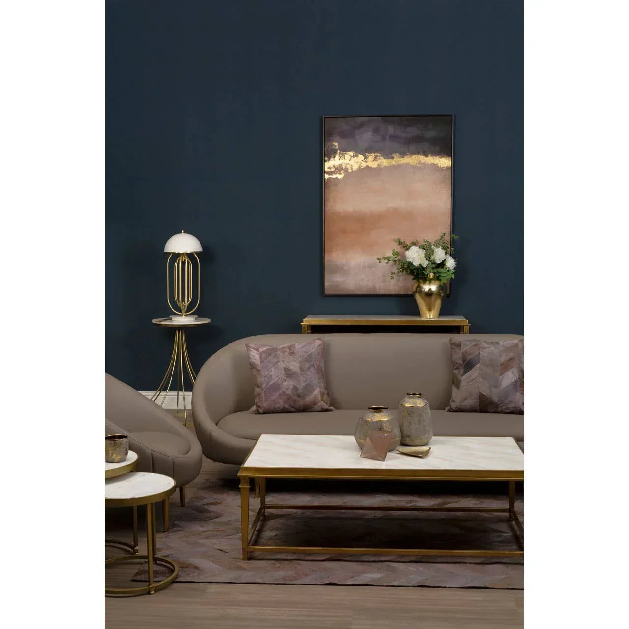 Modern beige sofa set with gold frame coffee table and abstract wall art in living room