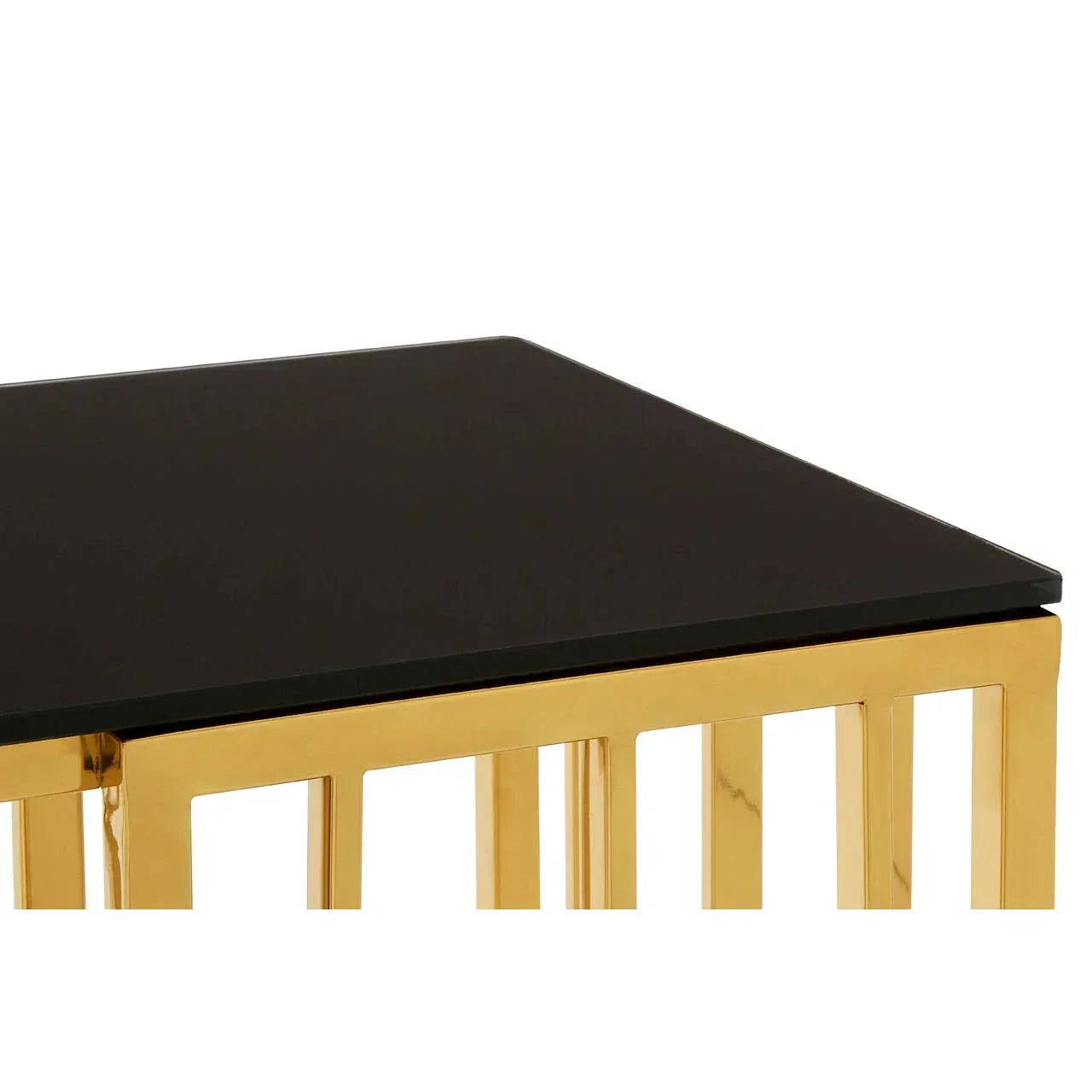 Square black glass coffee table with gold metal frame, close-up of corner detail