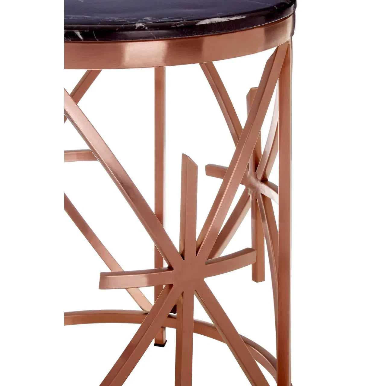 Round side table with black marble top and gold metal geometric base close up