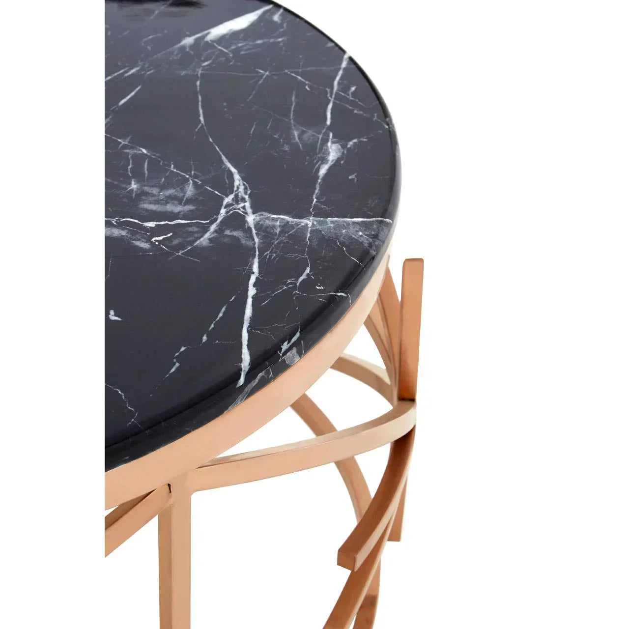 Round black marble coffee table with gold metal frame, close-up of tabletop and base