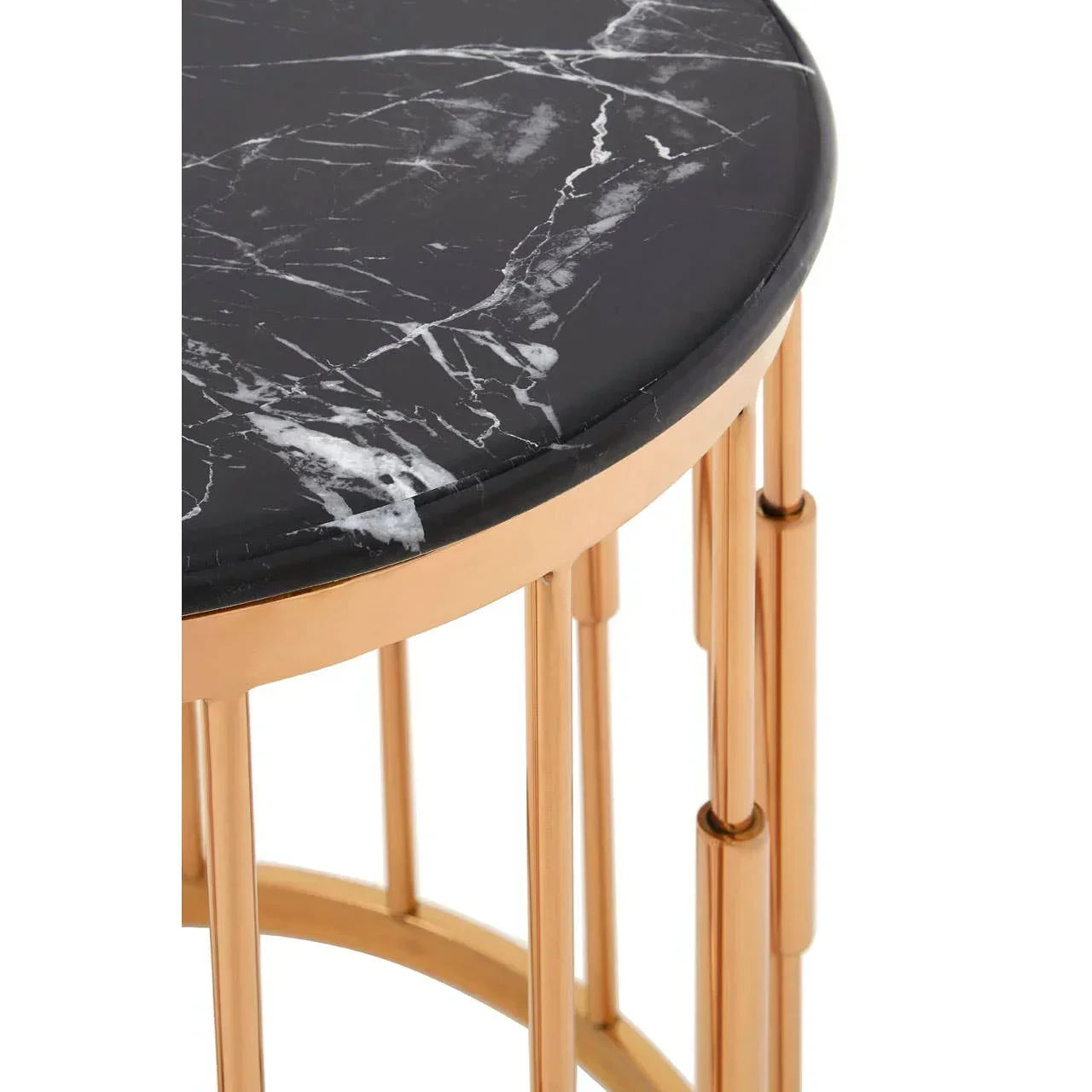 Round black marble side table with gold metal frame, close-up of tabletop and legs