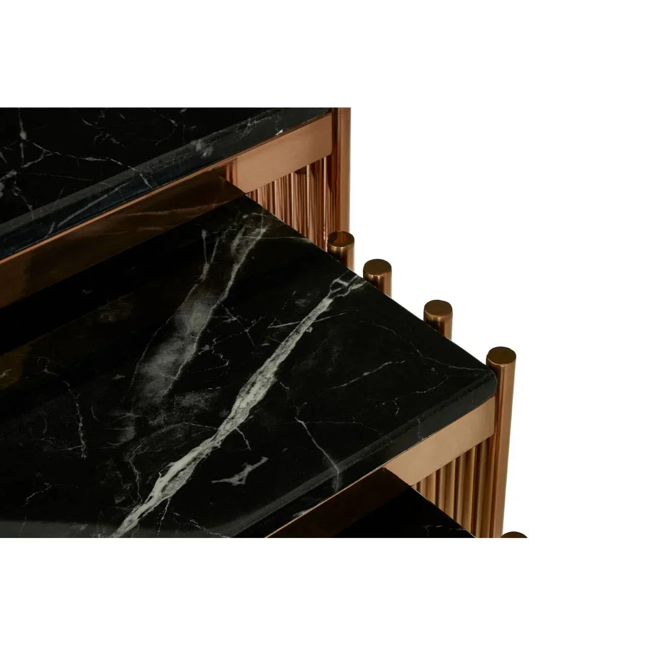 Close-up of black marble coffee table with gold frame and white veining