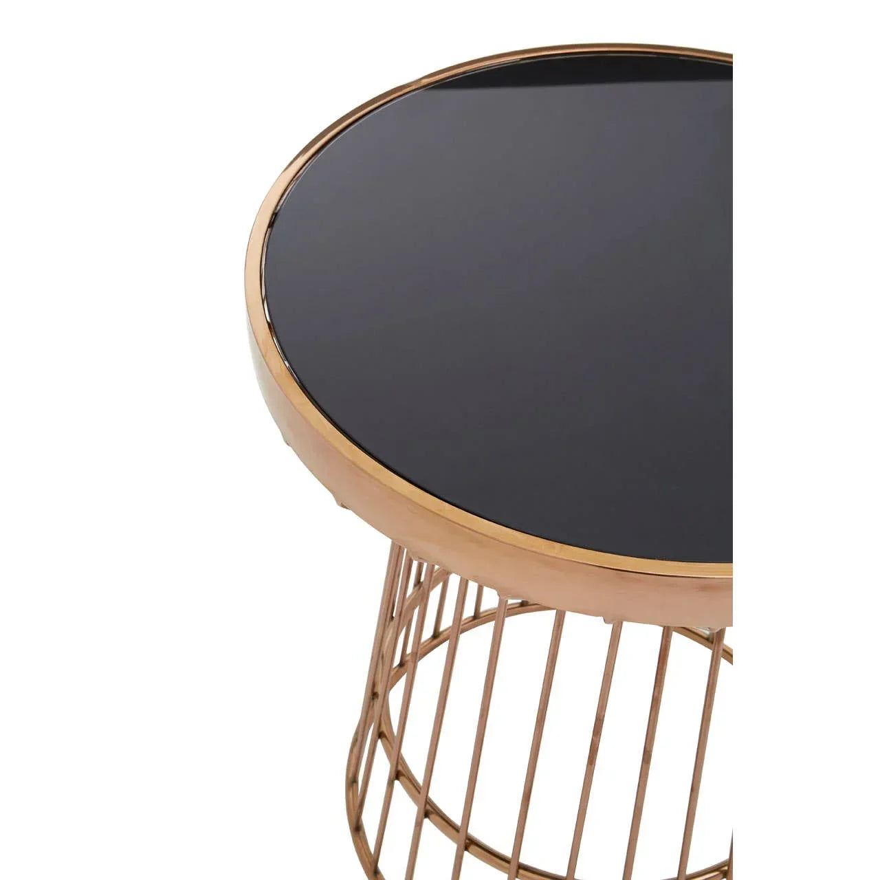 Round side table with black glass top and gold metal base, angled view