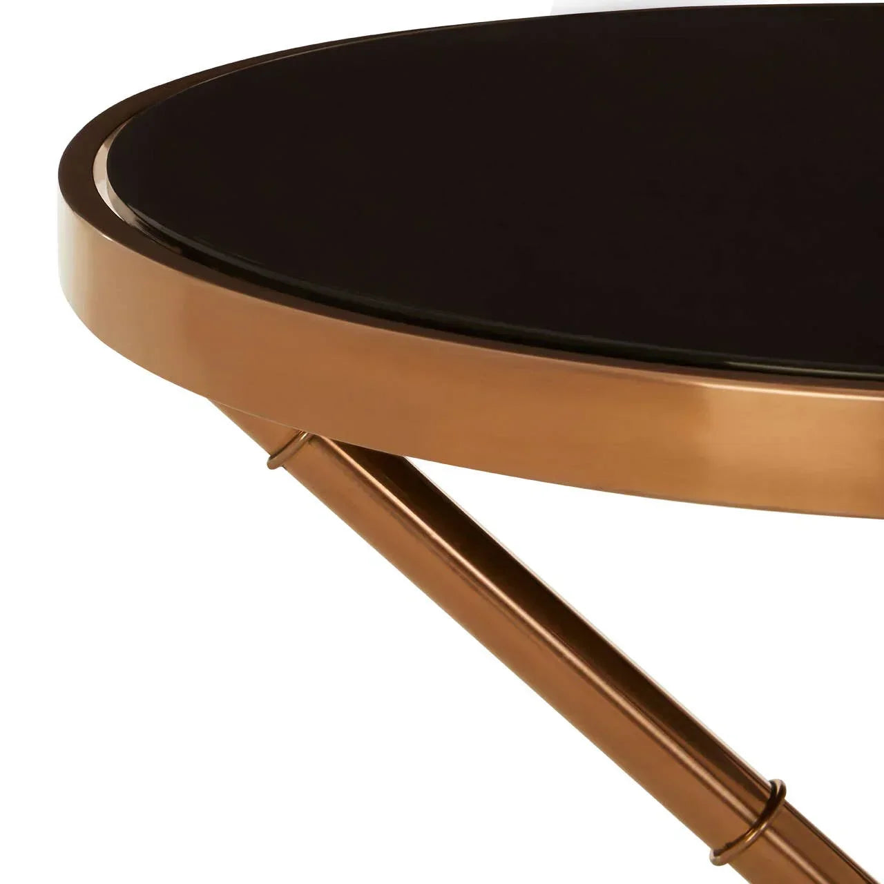 Round glass top coffee table with gold metal frame, close-up of edge and leg