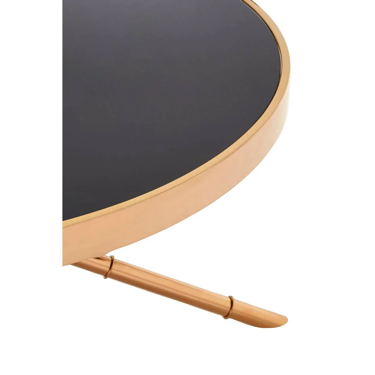 Round black and gold metal side table closeup, showing frame and leg detail