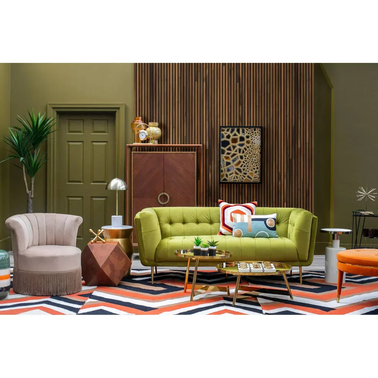 Green upholstered sofa set with accent cushions in modern living room, geometric rug and decor