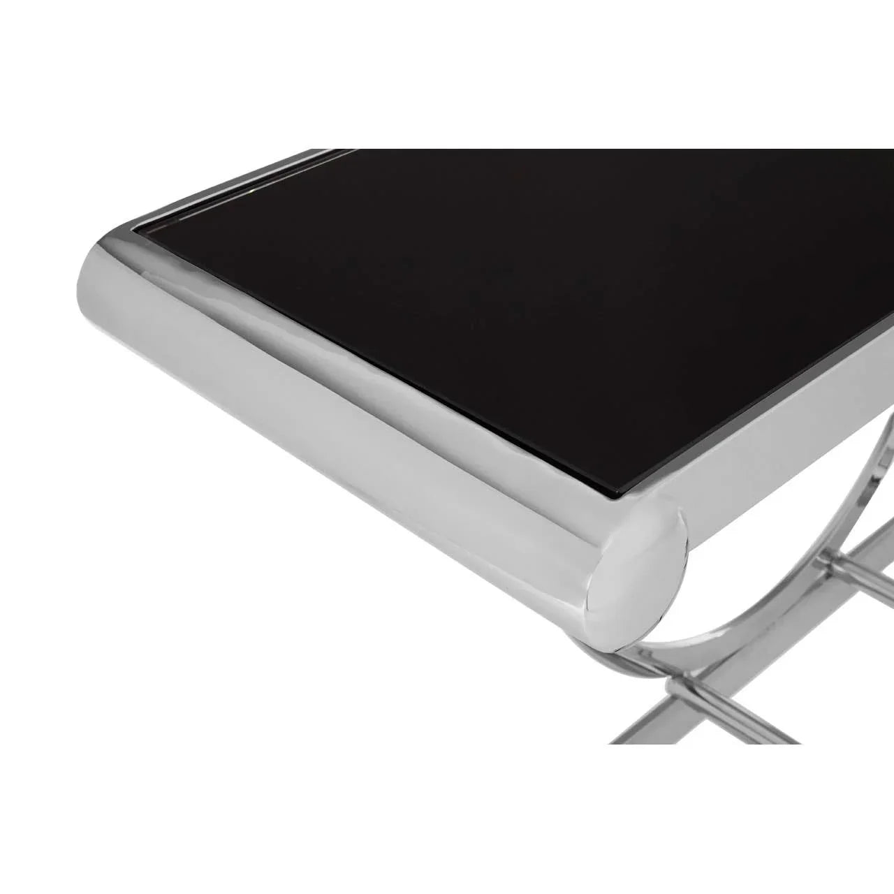 Close-up of modern console table with black glass top and chrome frame