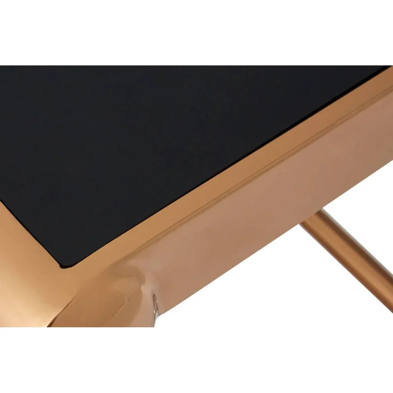 Closeup of black glass coffee table with gold metal frame and corner detail