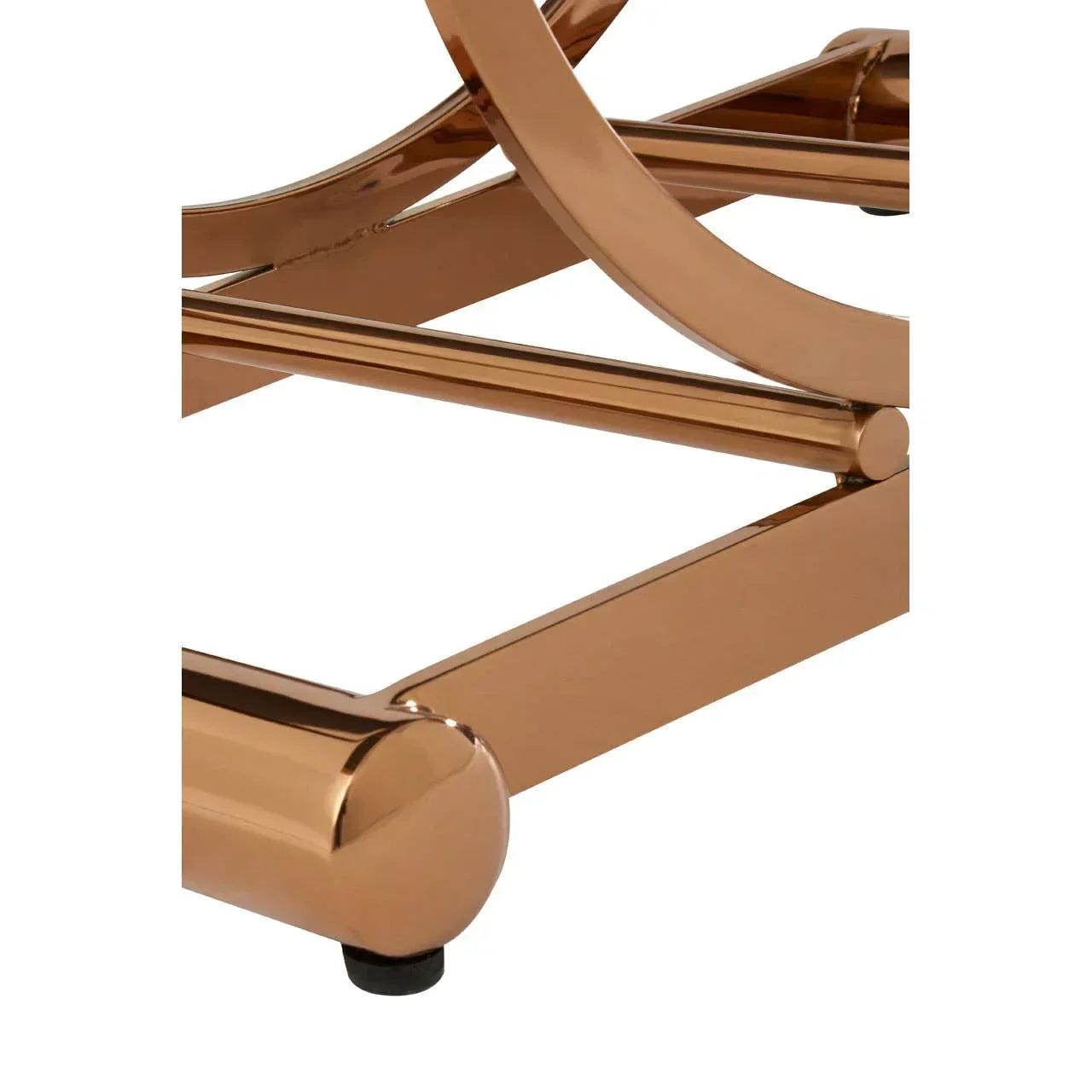 Close-up of gold metal coffee table frame with curved and rectangular support bars