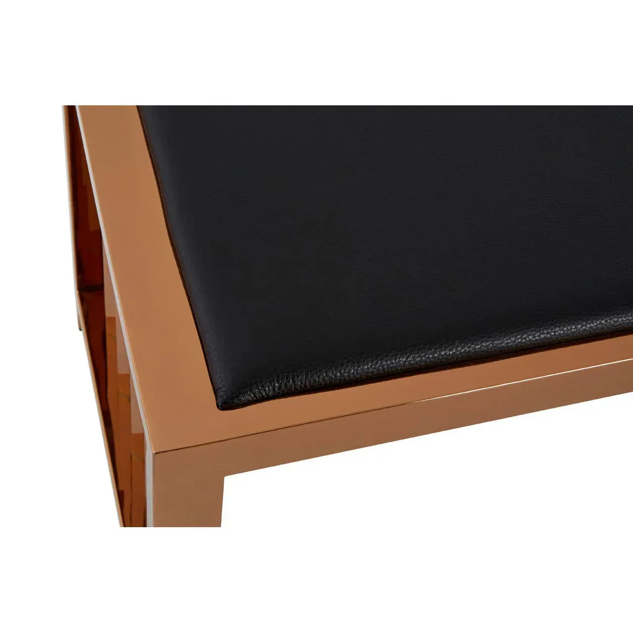 Closeup of bench with black faux leather seat and gold metal frame
