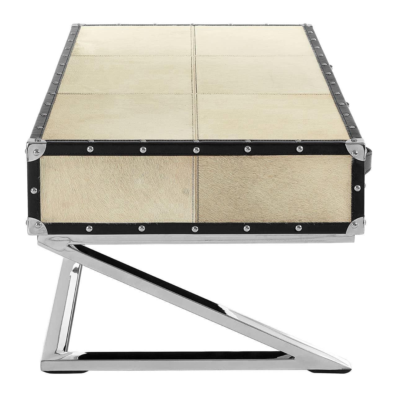 Beige leather coffee table with black trim and chrome metal base, front angle view