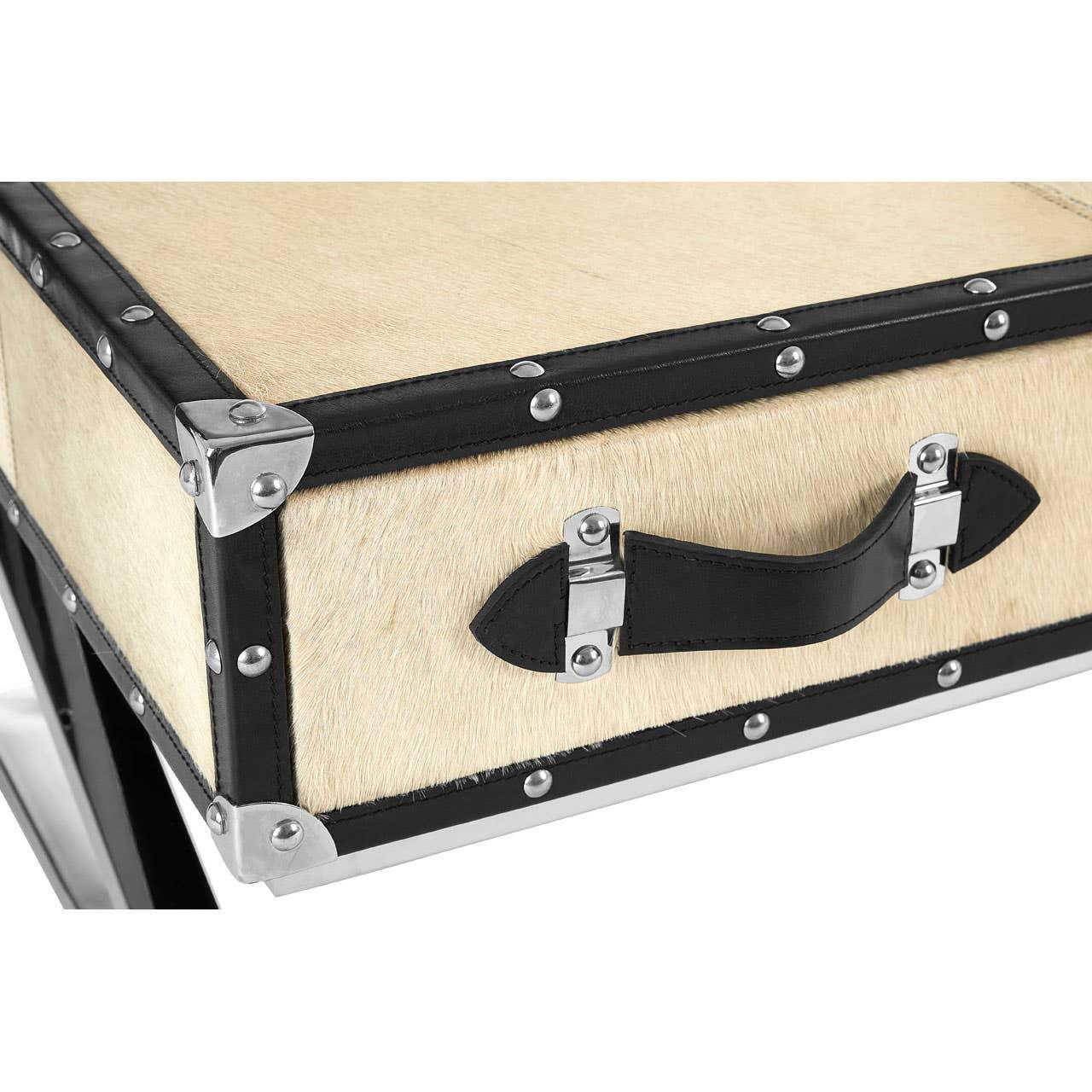 Cream trunk-style side table with black leather trim and chrome corner detailing