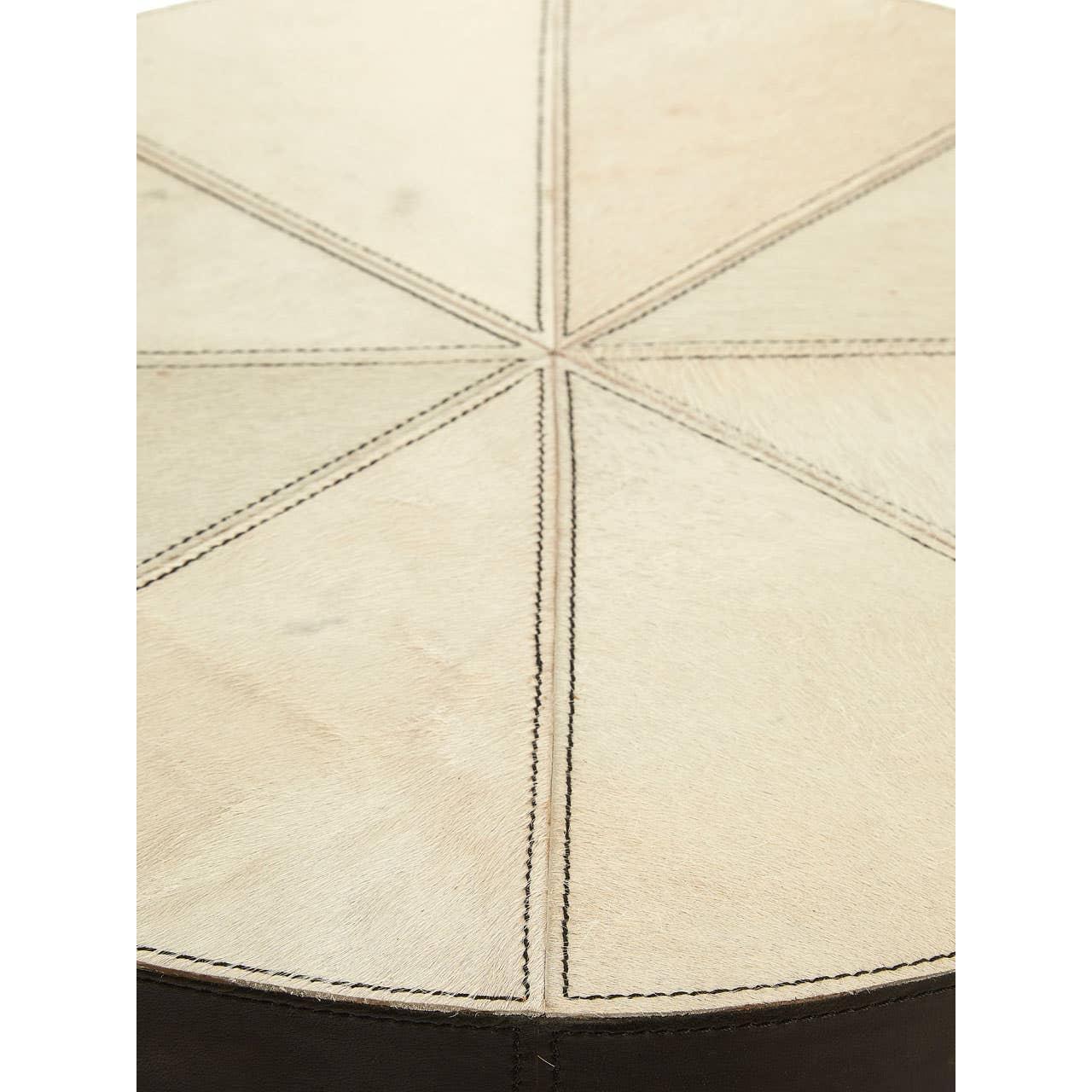 Round cream cowhide pouffe top with stitched panel detail and dark leather side