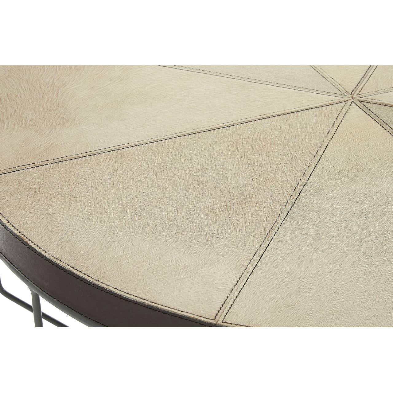 Round coffee table with beige stitched leather top and metal frame detail
